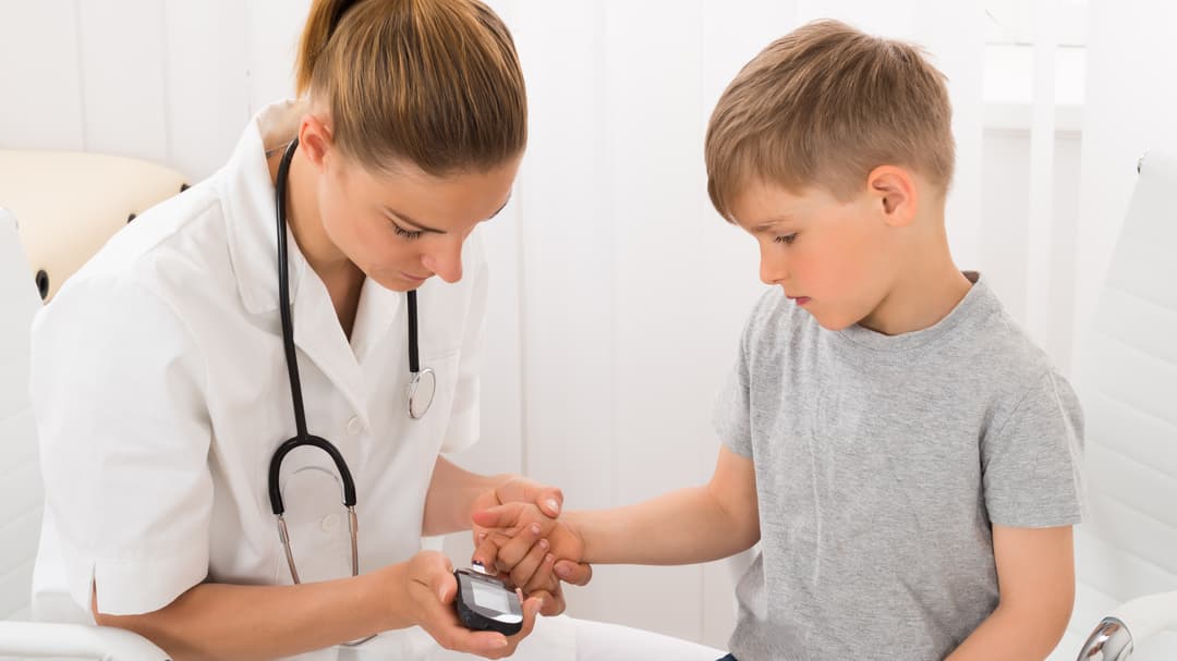 16561496-doctor-examining-blood-sugar-of-little-boy.jpg