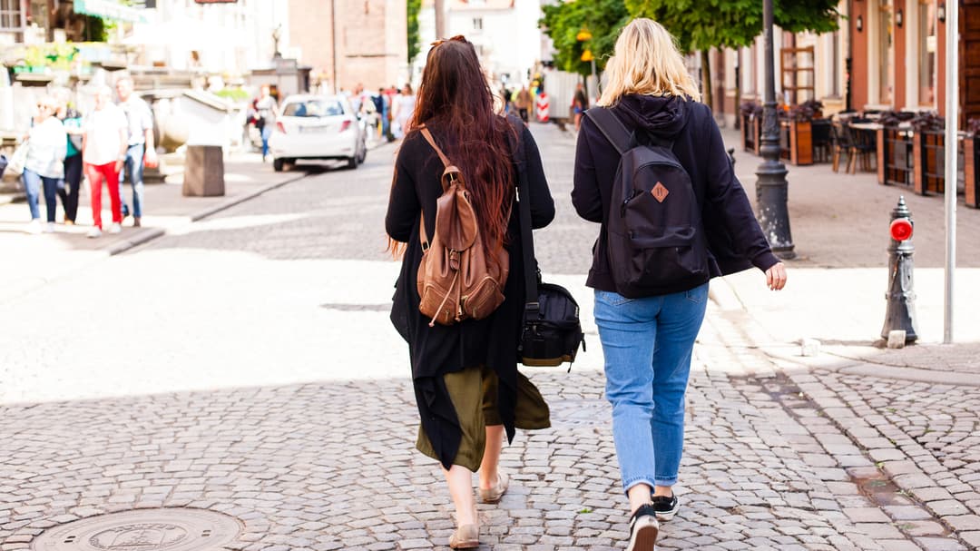 22737418-urban-life-two-young-girls-walking-on-the-street.jpg