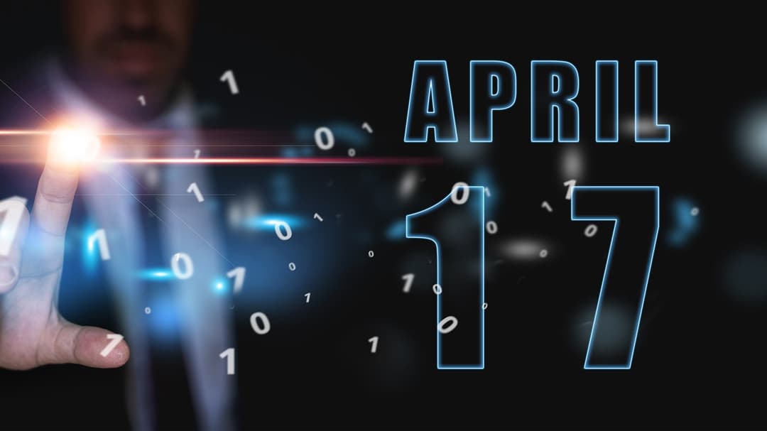17 april. Dag 17 i månaden, reklam eller högteknologisk kalender, man i kostym trycker på ljusa virtuella knappen vårmånad, årets dag koncept.