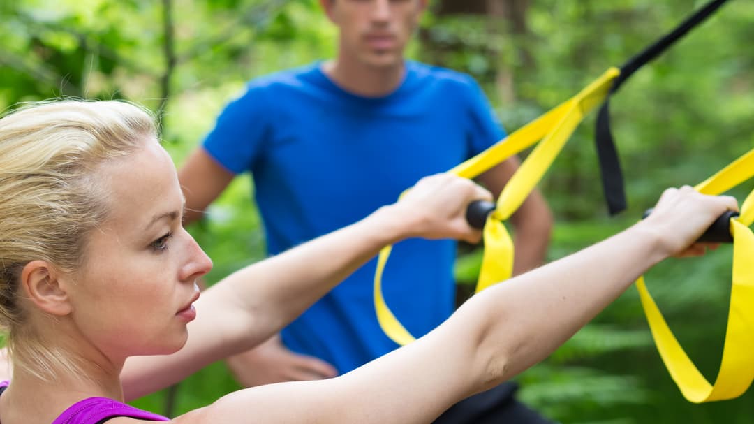 8876432-training-with-fitness-straps-outdoors.jpg