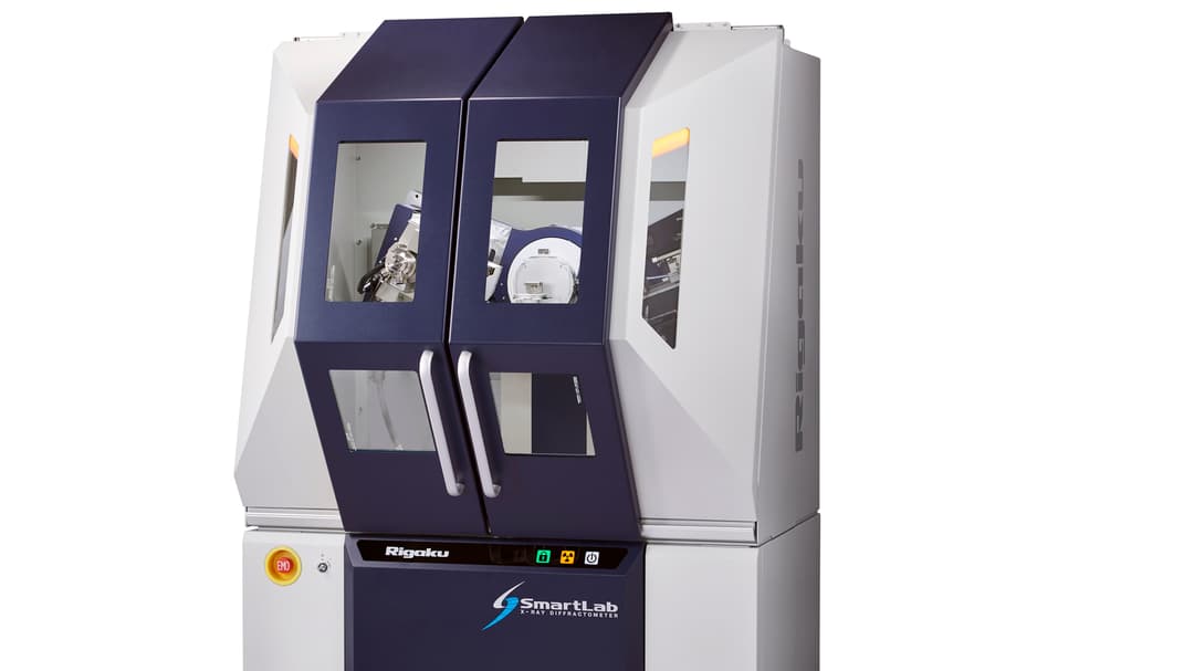 A white and dark blue machine for laboratories