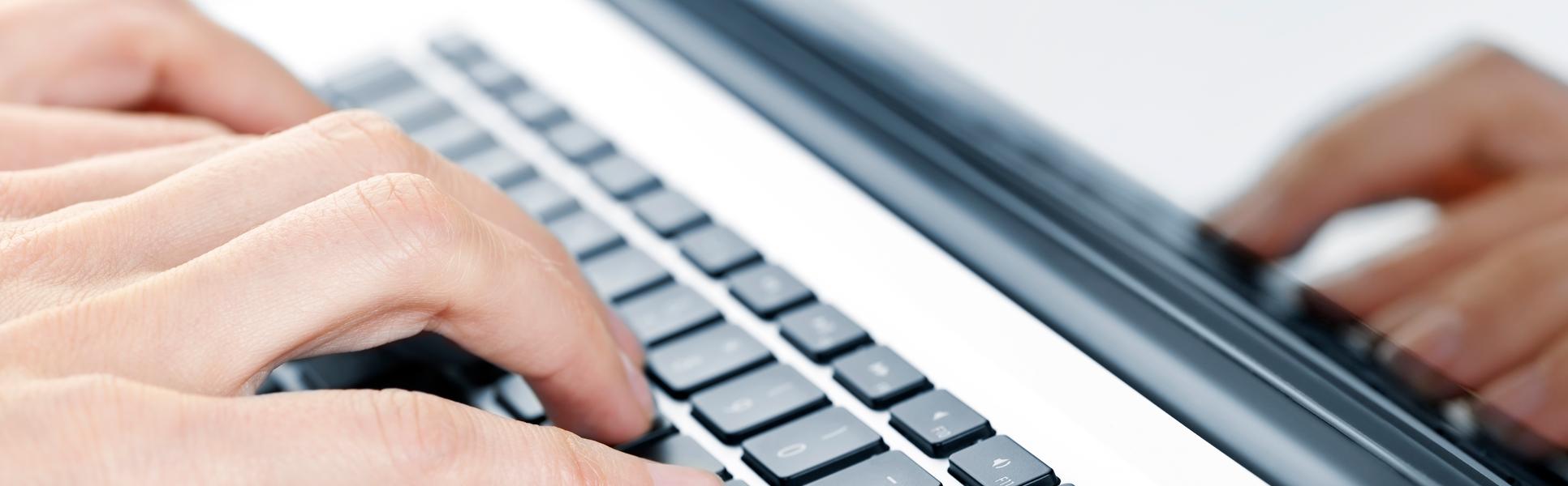 2202317-hands-typing-on-laptop-keyboard.jpg