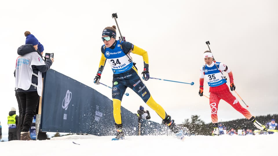 Biathlete in the Swedish national team skating towards the camera