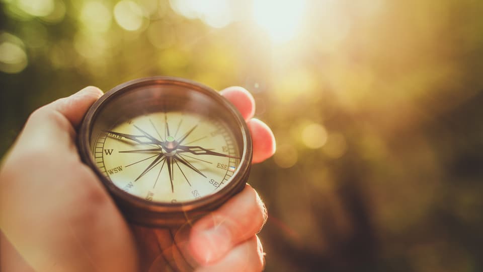 33086380-trial-hiking-with-compass.jpg