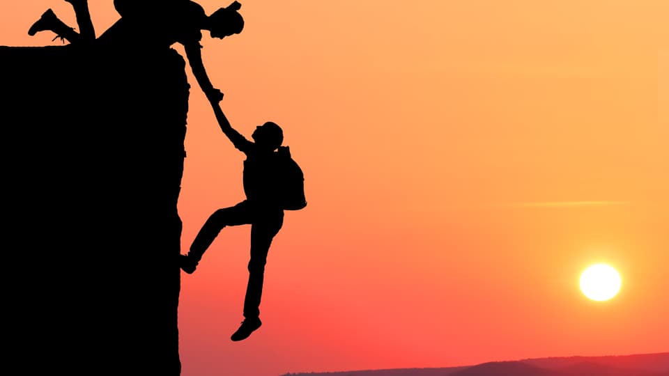Teamwork couple hiking help each other trust assistance