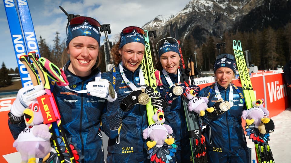 Biathlon relay team with bronze medals.