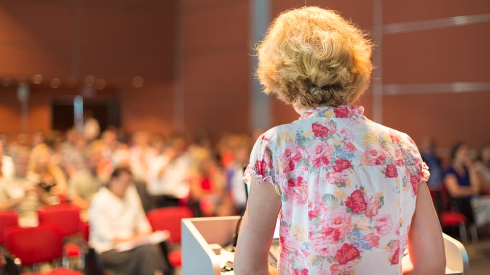 9431907-female-academic-professor-lecturing.jpg