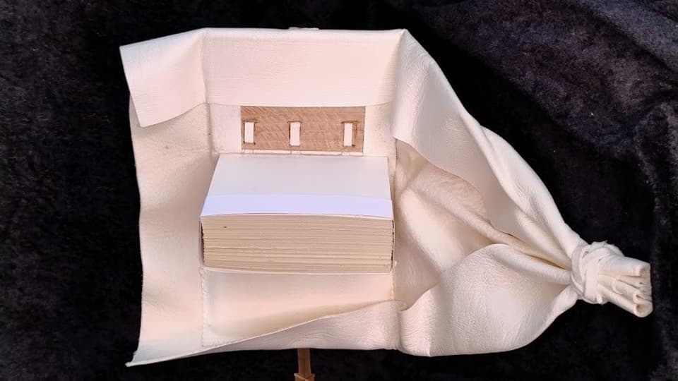 book in white fabric