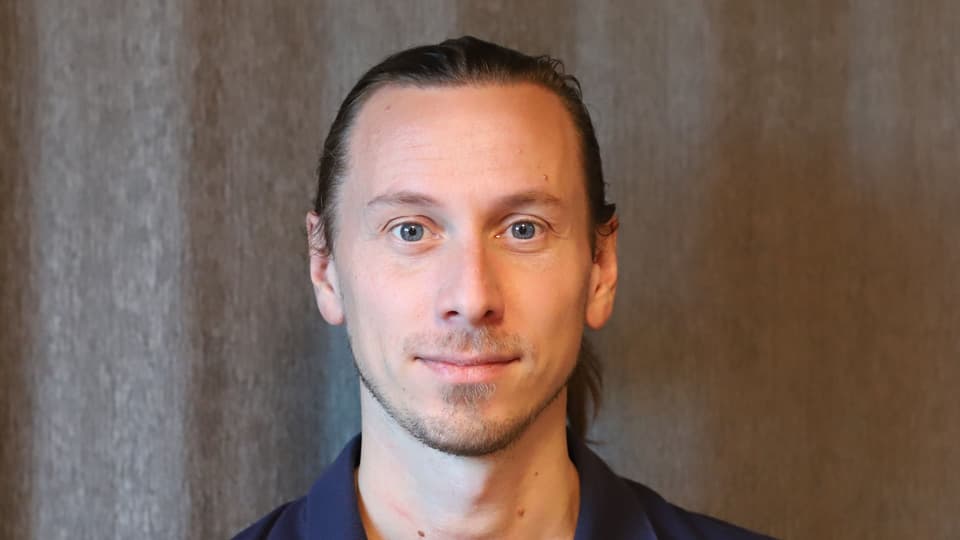A man with a blue shirt