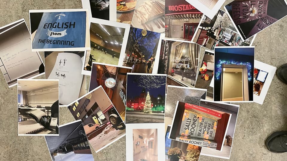 Printed photographs are scattered on a floor.