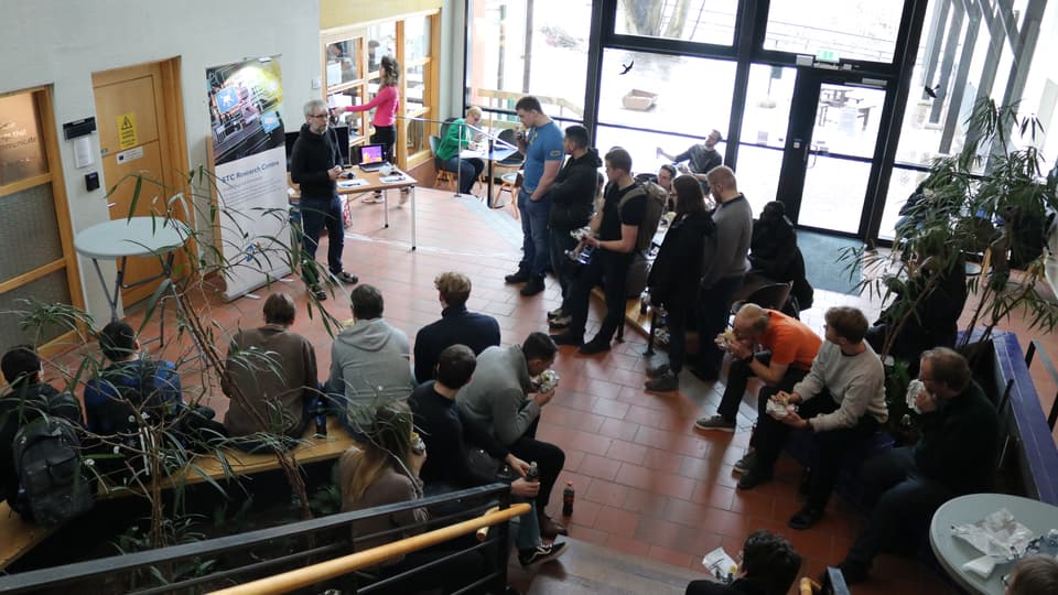 Students gathering and listens to a speaker