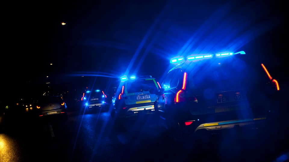 Police cars with lights on.