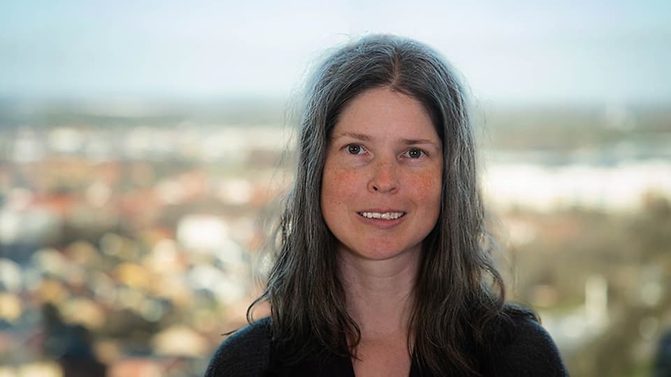 A woman with long, dark hair