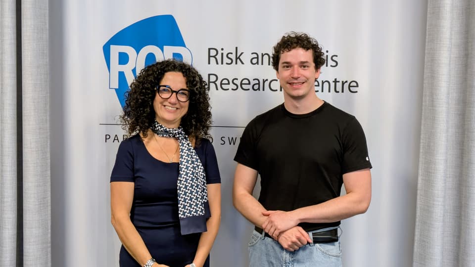 A woman and a man smiling at the camera
