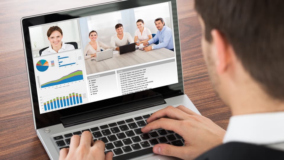 15129799-businessman-video-conferencing-on-laptop.jpg